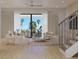 Bright and airy living room with floor to ceiling windows and balcony access overlooking palm trees at 4535 26Th S Ave, St Petersburg, FL 33711