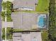 A bird's-eye perspective of the home, highlighting its private pool, well-manicured lawn, and appealing neighborhood at 4544 Vermillion Sky Dr, Wesley Chapel, FL 33544