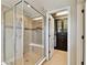 Bathroom showcasing a walk-in shower with a built-in bench seat and tiled walls at 4544 Vermillion Sky Dr, Wesley Chapel, FL 33544