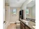 Full bathroom with modern vanity, toilet, built-in shelving, and shower tub at 4544 Vermillion Sky Dr, Wesley Chapel, FL 33544