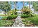 A lush community park featuring a pergola covered path with lush landscape creating a serene outdoor escape at 4544 Vermillion Sky Dr, Wesley Chapel, FL 33544
