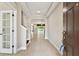 Inviting entryway with tile flooring leading to a spacious open-concept living area with a view to the pool at 4544 Vermillion Sky Dr, Wesley Chapel, FL 33544