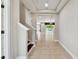 Entryway foyer with neutral walls and tile flooring, leading to a view of the pool at 4544 Vermillion Sky Dr, Wesley Chapel, FL 33544