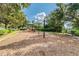 Outdoor playground with swings and slides, perfect for families looking to enjoy outdoor recreation and green space at 4544 Vermillion Sky Dr, Wesley Chapel, FL 33544
