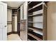 Spacious walk-in closet featuring custom shelving and ample storage space at 4544 Vermillion Sky Dr, Wesley Chapel, FL 33544