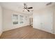 Spacious bedroom featuring wood floors, lots of natural light, and large closets at 5027 Autumn Ridge Dr, Wesley Chapel, FL 33545