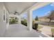 Covered front porch with ceiling fans, perfect for enjoying the outdoors at 5027 Autumn Ridge Dr, Wesley Chapel, FL 33545