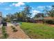 Backyard patio featuring outdoor seating and a grill perfect for outdoor dining and relaxation at 512 Crystal Grove Blvd, Lutz, FL 33548
