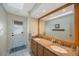 Bathroom featuring a double vanity, granite counters, and ample counter space at 512 Crystal Grove Blvd, Lutz, FL 33548