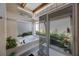Soaking tub and glass shower featuring garden views in this bright bathroom at 512 Crystal Grove Blvd, Lutz, FL 33548
