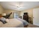 Bedroom with a ceiling fan, a dresser, and an exercise machine at 512 Crystal Grove Blvd, Lutz, FL 33548