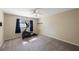 Bedroom features a ceiling fan, neutral decor, and an exercise machine at 512 Crystal Grove Blvd, Lutz, FL 33548