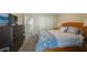 Bedroom with an attached closet and a traditional wooden bed at 512 Crystal Grove Blvd, Lutz, FL 33548