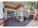 Welcoming front entrance with double doors, brick accents, and lush landscaping at 512 Crystal Grove Blvd, Lutz, FL 33548