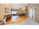 Inviting living area with a pool table, piano, and comfortable seating space at 512 Crystal Grove Blvd, Lutz, FL 33548
