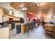 Open kitchen featuring an island with bar seating and view into the living room at 512 Crystal Grove Blvd, Lutz, FL 33548