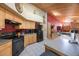 Bright eat-in kitchen with stainless steel appliances and views into the living room at 512 Crystal Grove Blvd, Lutz, FL 33548