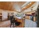 Charming kitchen with a breakfast bar and wood-paneled ceilings and ample natural light at 512 Crystal Grove Blvd, Lutz, FL 33548
