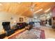 Open floor plan showing the living room with wood ceilings flowing into the kitchen at 512 Crystal Grove Blvd, Lutz, FL 33548