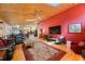 Open concept living room flowing into the kitchen with hardwood floors and vaulted wood ceilings at 512 Crystal Grove Blvd, Lutz, FL 33548
