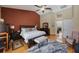 Large bedroom with wooden floors, vaulted ceilings, area rug, and stylish decor at 512 Crystal Grove Blvd, Lutz, FL 33548