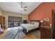 Spacious main bedroom boasting pool views, wooden floors, and plenty of natural light at 512 Crystal Grove Blvd, Lutz, FL 33548