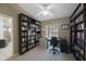 Office space featuring carpet, window, built-in bookshelves, and neutral paint at 512 Crystal Grove Blvd, Lutz, FL 33548