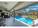 Inviting pool and spa under a screened enclosure, promising year-round relaxation and enjoyment at 512 Crystal Grove Blvd, Lutz, FL 33548