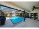 The pool is partially screened and features comfortable seating, perfect for relaxing and entertaining at 512 Crystal Grove Blvd, Lutz, FL 33548