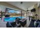 Sparkling pool with screened-in lanai, and comfortable seating, perfect for Florida outdoor living at 512 Crystal Grove Blvd, Lutz, FL 33548