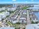 Aerial view showcases the community layout with uniform home designs and streetscapes at 5351 Bridge St # 16, Tampa, FL 33611