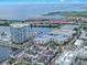 Aerial view of white residential neighborhood with a marina and water views in the background at 5351 Bridge St # 16, Tampa, FL 33611