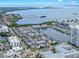 Aerial view of white residential neighborhood with a marina and water views in the background at 5351 Bridge St # 16, Tampa, FL 33611
