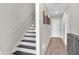 Hallway with wood floors, white walls, and white doors at 5351 Bridge St # 16, Tampa, FL 33611