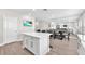 Bright kitchen with white cabinets, stainless steel appliances and an expansive open floor plan at 5351 Bridge St # 16, Tampa, FL 33611