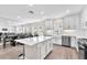 Bright white kitchen offering stainless steel appliances and an open floor plan at 5351 Bridge St # 16, Tampa, FL 33611