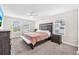 Comfortable bedroom with ceiling fan, plush carpet, large bed, and windows offering great natural light at 5351 Bridge St # 16, Tampa, FL 33611