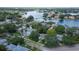 An aerial view showcases the neighborhood homes, with lush trees and waterway views at 555 21St Ne Ave, St Petersburg, FL 33704