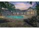 Inviting backyard with a private pool, brick patio, and ample space for lounging and entertaining at 555 21St Ne Ave, St Petersburg, FL 33704