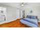 Comfortable bedroom featuring hardwood floors and adjacent bathroom for convenience at 555 21St Ne Ave, St Petersburg, FL 33704