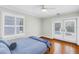 Bright bedroom with hardwood floors and French doors leading to the backyard pool at 555 21St Ne Ave, St Petersburg, FL 33704