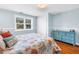 Inviting bedroom is adorned with a coastal-themed bedspread and blue accent furniture at 555 21St Ne Ave, St Petersburg, FL 33704