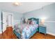 Light-filled bedroom boasts hardwood floors and beach-themed decor, creating a relaxing space at 555 21St Ne Ave, St Petersburg, FL 33704