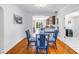 The dining room has wood floors and views of the kitchen and other rooms in the home at 555 21St Ne Ave, St Petersburg, FL 33704