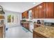 This well-lit kitchen offers stainless appliances, granite countertops, and wood cabinets at 555 21St Ne Ave, St Petersburg, FL 33704