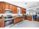Bright kitchen with wood cabinets, stainless steel appliances, and granite countertops at 555 21St Ne Ave, St Petersburg, FL 33704