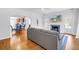 Bright living room featuring hardwood floors, fireplace, and open access to the kitchen at 555 21St Ne Ave, St Petersburg, FL 33704