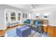 Inviting living room featuring hardwood floors, a bay window, and comfortable, stylish furnishings at 555 21St Ne Ave, St Petersburg, FL 33704