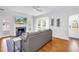 Bright living room with hardwood floors, fireplace, and bay window allowing for lots of natural light at 555 21St Ne Ave, St Petersburg, FL 33704
