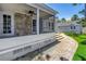 The screen enclosed patio features a decorative stone accent wall and direct access to the lush green backyard at 555 21St Ne Ave, St Petersburg, FL 33704